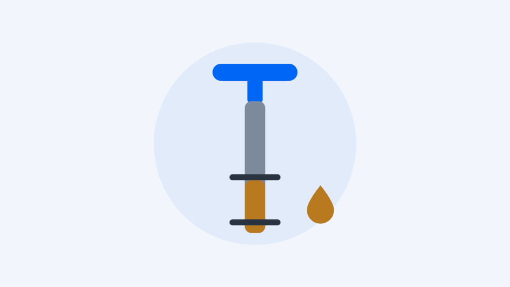 Illustration of an engine oil dipstick with a T-handle, showing oil between the two level marks
